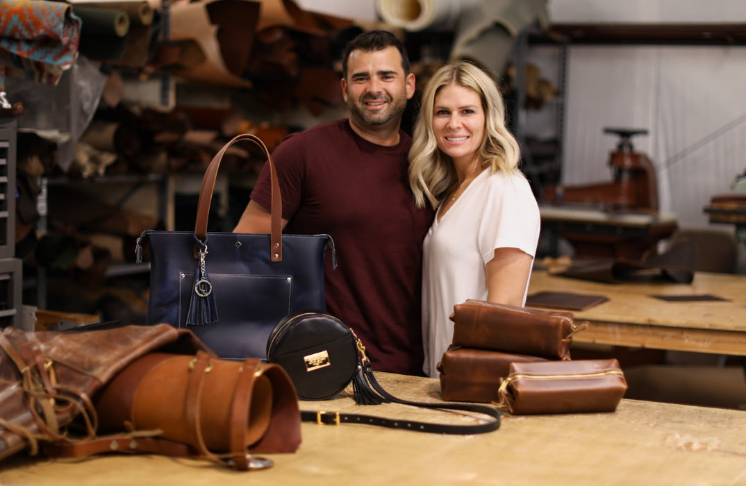 The Lifetime Leather makers in the workshop with their handmade leather goods