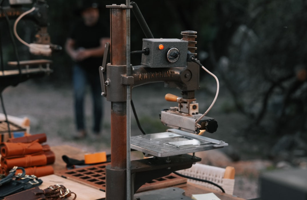 A hand fire-branding press in the Lifetime Leather workshop